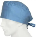 The image shows a blue surgical cap on a mannequin head. The cap is made of a soft, lightweight fabric and has a curved brim....