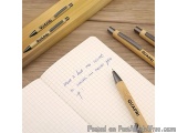 The image shows a notebook with a handwritten note on it. The note reads "There's but one secret to success - never give up!"...