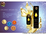 The image is an advertisement for organic argan oil for whole-body skin care. It features a bottle of the oil on the right si...