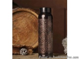 The image shows a black water bottle with a black lid. The bottle is cylindrical in shape and has a metallic finish. The body...