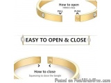 The image shows a gold bangle bracelet with two buttons on it. The first button is labeled "How to open" and the second butto...