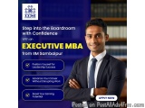 The image is an advertisement for an Executive MBA from IIM Sambalpur. It features a young man in a suit and tie standing in...