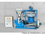 The image shows a blue-colored industrial machine, which appears to be a type of waste tyre pyrolysis plant. The machine is m...