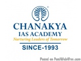 The image is a logo of the Chanakya IAS Academy, a university in India. The logo is a blue circle with a white tree in the ce...