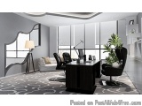 The image shows a modern office space with a large window on the right side. The window has white blinds that let in natural...