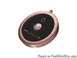 The image is of a round, rose gold-colored object with a black background. The object appears to be made of metal and has a t...