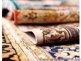 The image shows a close-up of a rolled up piece of fabric with a colorful floral pattern. The fabric appears to be made of a...
