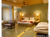 The image shows a modern and luxurious bedroom with a large double bed in the center. The bed has a beige headboard and white...