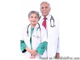 The image shows a man and a woman dressed in white medical uniforms. They are standing side by side and are both wearing stet...