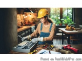 In this image, we can see a young woman wearing a yellow hard hat and overalls, working in a kitchen. She is standing in fron...