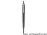 The image is of a silver-colored ballpoint pen. The pen has a sleek and modern design with a pointed tip and a slim body. The...