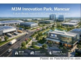 The image is an aerial view of M3M Innovation Park, Manesar, a future-ready industrial and commercial destination. The park i...