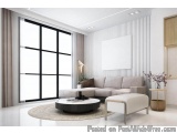 The image shows a modern living room with a large window on the left side. The window has white curtains and is letting in na...