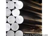 The image shows a group of small, round, white circles arranged in a diagonal pattern. The circles appear to be made of metal...