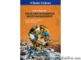 The image is the cover of a book titled "A Text Book on Solid and Hazardous Waste Management". The cover is predominantly ora...
