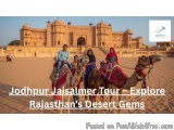 The image shows a group of four people riding camels in front of the Taj Mahal, a historical monument located in Jaisalmer, R...