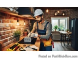 In this image, we can see a man wearing a white hard hat and overalls, working in a kitchen. He is standing in front of a bri...