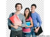 The image shows three young people, two men and a woman, standing together and smiling at the camera. They are all holding fo...
