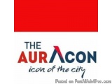 The image is a logo for a company called "The AuraCon". The logo is rectangular in shape and has a red background. The word "...
