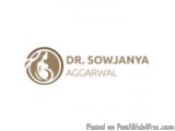 The image is a logo for Dr. Sowjanya Aggarwal. The logo is a circular shape with a white background and a brown border. Insid...
