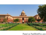The image shows a large, ornate building with a dome on top. The building appears to be a government or government building,...