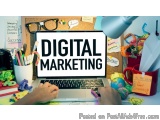 The image shows a desk with a laptop in the center. The laptop screen displays the words "DIGITAL MARKETING" in bold, black l...