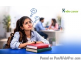 The image shows a young girl sitting at a desk with a stack of books in front of her. She is wearing a blue shirt and has a b...