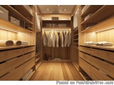 The image shows a modern and luxurious walk-in closet with wooden shelves and drawers. The closet has a wooden floor and wall...