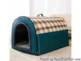 The image shows a blue pet bed with a checkered pattern on the top. The bed is rectangular in shape and has a curved roof. It...