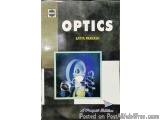 The image is the cover of a book titled "Optics" by Satya Prakash. The cover is predominantly black with a blue and white abs...