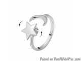 The image is a 3D rendering of a silver ring with a star and a crescent moon design. The ring is made of a shiny silver metal...