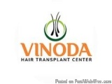The image is a logo for a hair transplant center called Vinoda Hair Transplant Center. The logo is rectangular in shape and h...