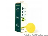 The image shows a green cardboard box with the brand name "bloom pickleball" written in white on the top. The box is rectangu...