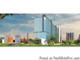 The image is a 3D rendering of a modern office building. The building is a tall, glass-enclosed structure with a red logo on...
