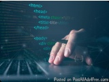The image shows a hand typing on a laptop keyboard with code written on it. The code is written in different colors and fonts...