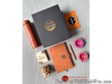 The image shows a flat lay of a gift set from the brand KGM, which is a gift store in Khandelwal, India. The gift set include...