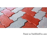 The image is a close-up of a surface made up of red and grey tiles arranged in a zigzag pattern. The tiles are arranged in an...
