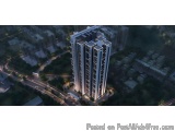 The image is an aerial view of a tall, modern building in the middle of a city. The building appears to be a high-rise, with...