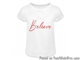 The image is of a white t-shirt with the word "Believe" written in red cursive font in the center. The word is written in a c...