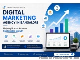 The image is an advertisement for a digital marketing agency in Bangalore, India. The background of the image is a blue sky w...