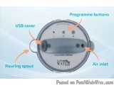 The image shows a diagram of a water purifier, which is a device used to purify water. It has a round, silver-colored body wi...