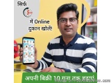 The image shows a man holding up a smartphone with a yellow background. He is wearing a blue and white striped polo shirt and...