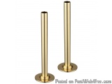 The image shows a pair of tall, cylindrical objects made of brass. They are standing upright on a round base. The objects app...