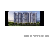 The image is a blurred view of a tall building. The building appears to be a high-rise structure with multiple floors and bal...