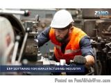 The image shows a man wearing a white hard hat and an orange safety vest working on a machine in a factory. He is holding a t...