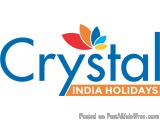 The image is a logo for Crystal India Holidays. The logo is written in a modern, sans-serif font and is in a blue color. The...