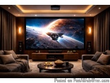 The image shows a modern home theater room with a large flat-screen TV mounted on the wall. The TV screen displays an image o...