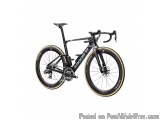 The image is of a black and gold-colored bicycle with the brand name "Argon 18" written on the frame. The bike has a sleek an...