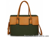 The image is of a handbag with a rectangular shape. The bag is made of a dark green canvas material with two leather panels o...