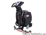 The image shows a black floor scrubber machine with a red base. The machine has a handle on the top for easy maneuverability....